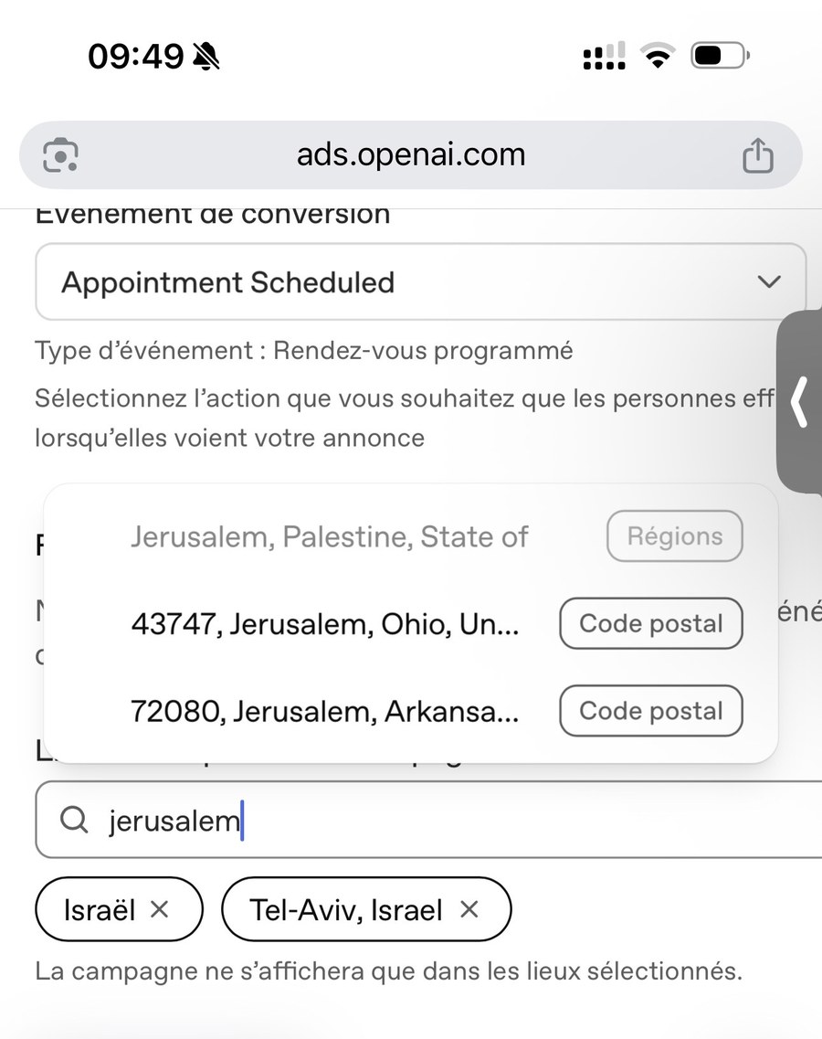Capture d’écran d’iPhone à 9 h 49, Ads Manager d’OpenAI (bêta) avec l’interface en français. « Israël » et « Tel-Aviv, Israël » sont déjà sélectionnés. La saisie « jerusalem » propose « Jerusalem, Palestine, State of » (Régions), puis les codes postaux 43747 (Jerusalem, Ohio) et 72080 (Jerusalem, Arkansas).